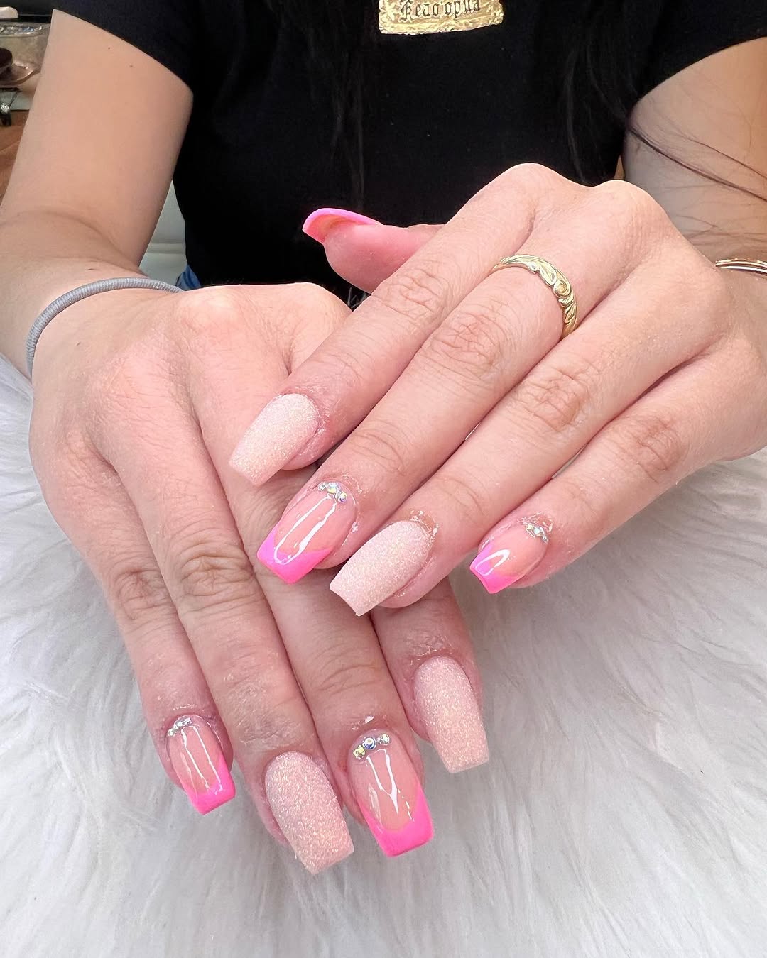 Soft nude pink ombre coffin nails with rhinestone accents