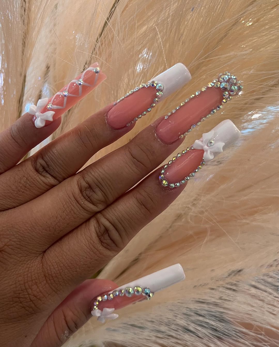 Coral and white glam nail set with 3D bows and rhinestone borders